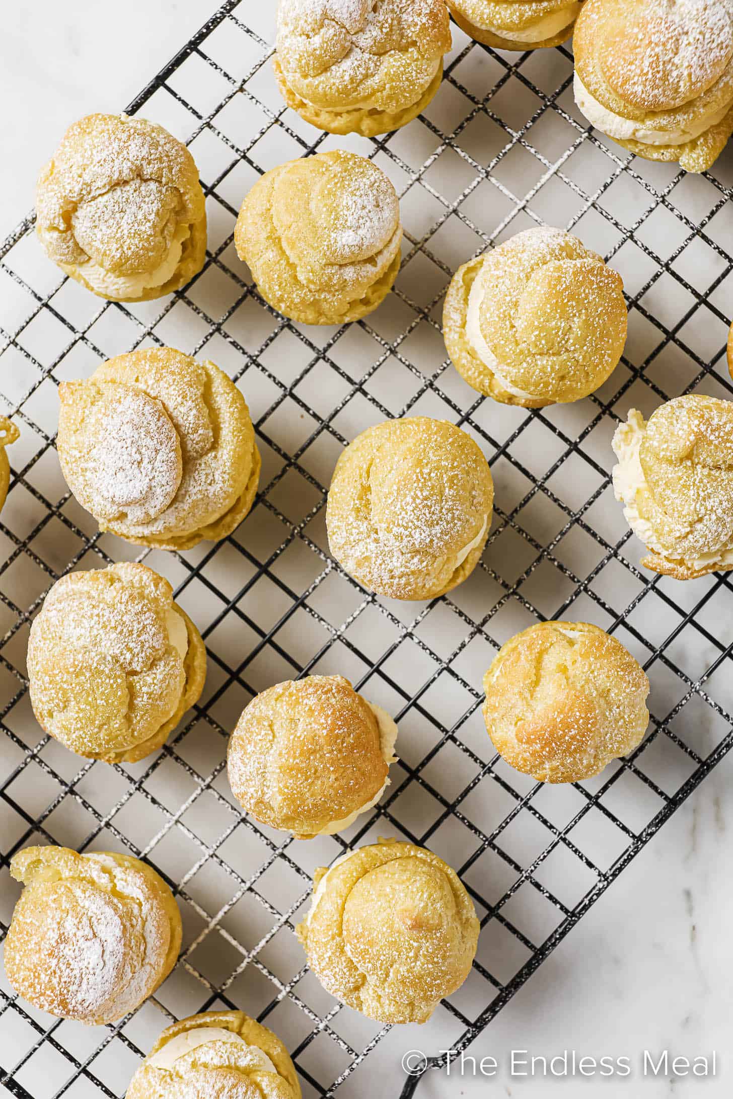 looking down on cream puffs stuffed with whipping cream