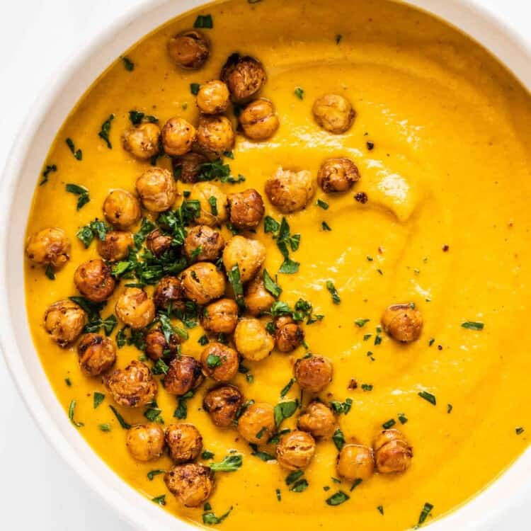 Roasted Carrot Soup with chickpea croutons in a bowl