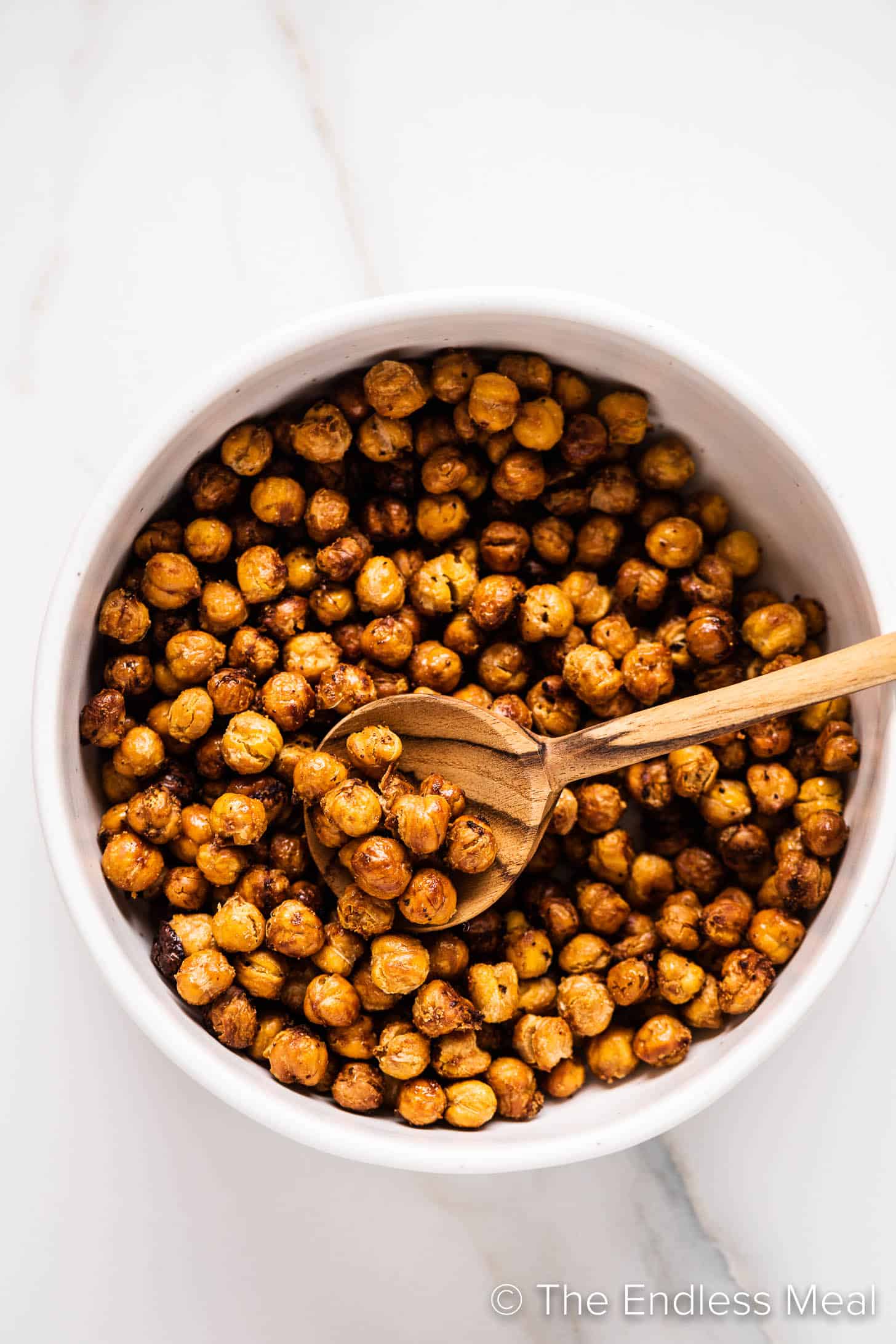 looking down on baked chickpeas in a bowl