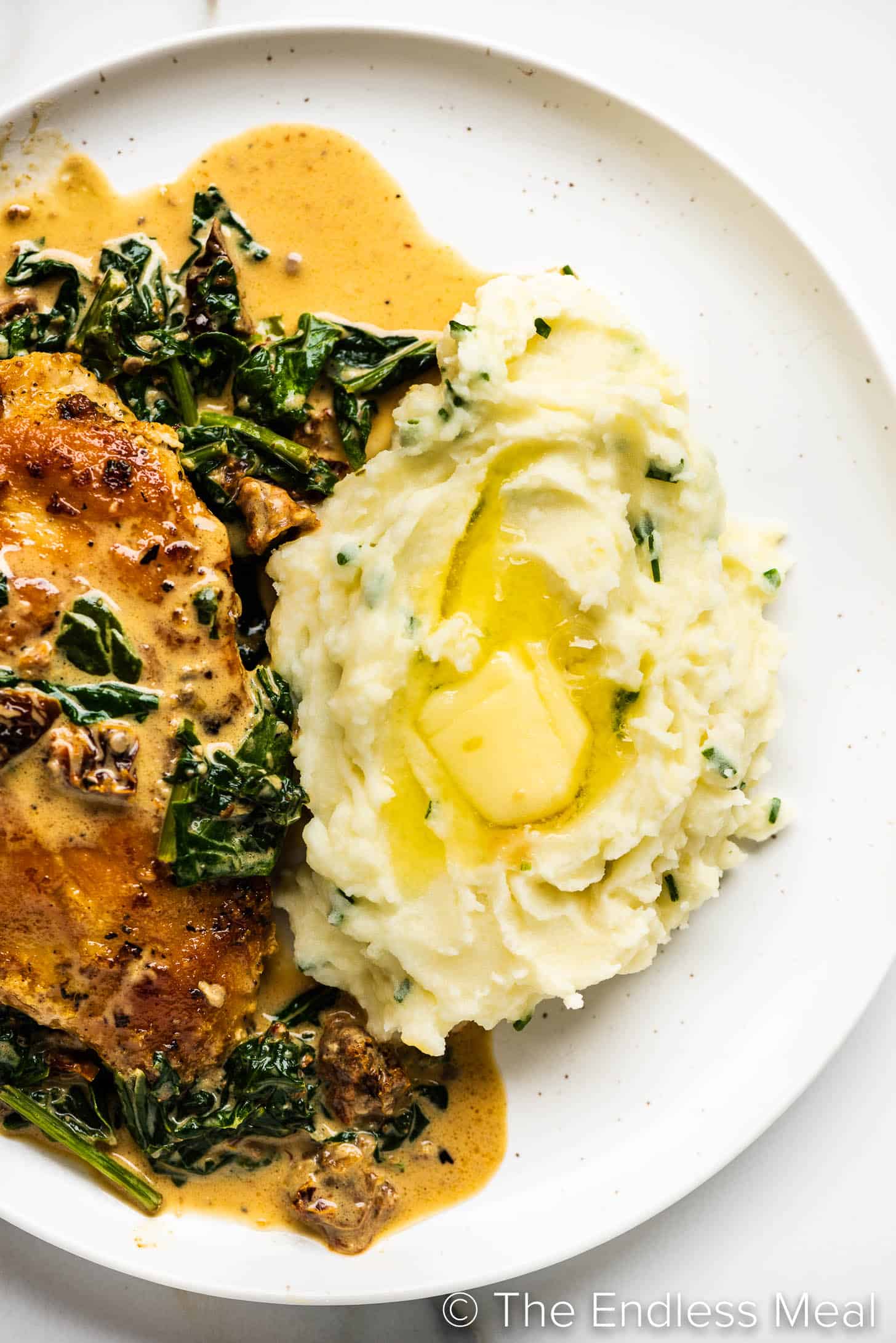serving mashed potatoes with sour cream and chives with chicken