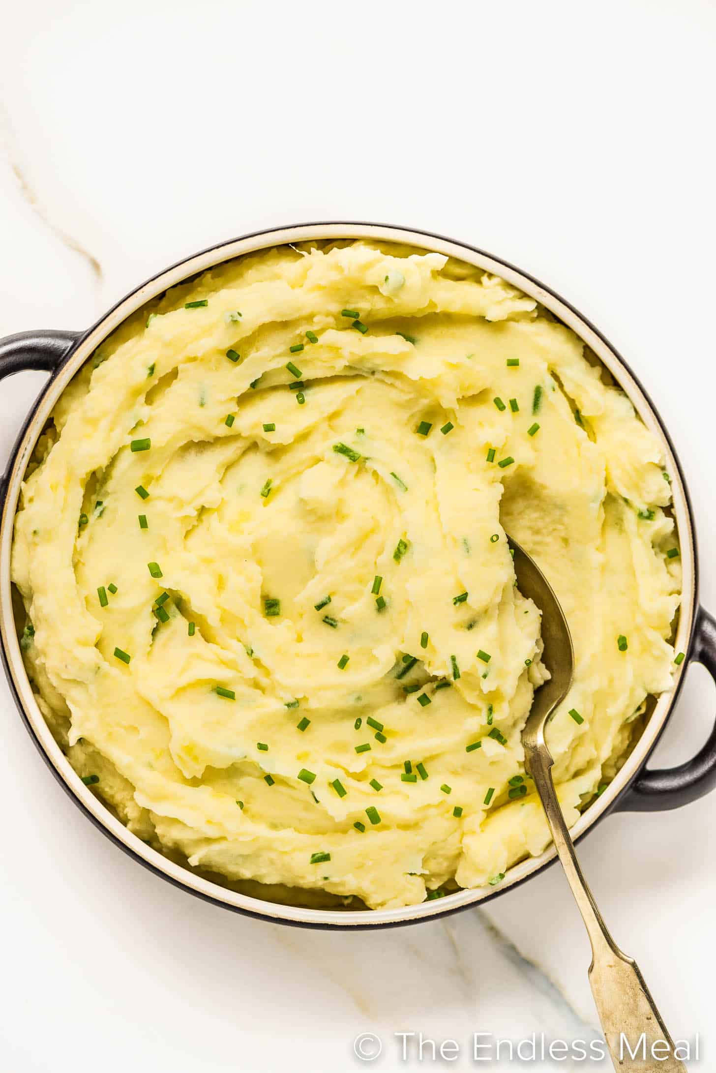 Sour Cream and Chive Mashed Potatoes in a serving dish