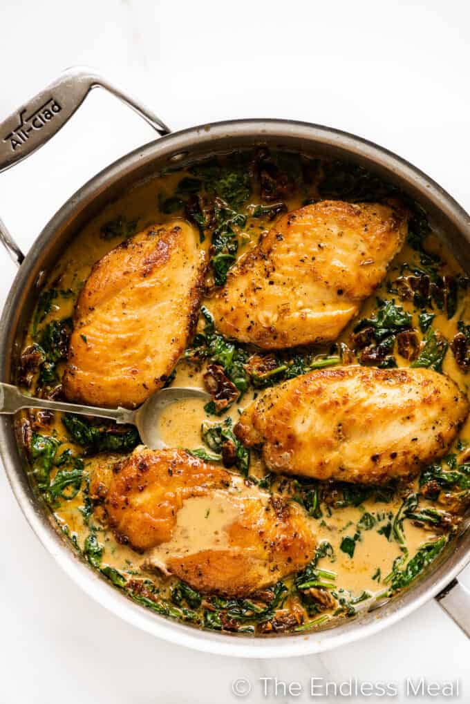 Sun Dried Tomato Chicken in a creamy sauce in a pan