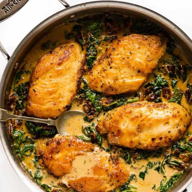 Sun Dried Tomato Chicken in a creamy sauce in a pan
