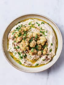 Cauliflower Hummus in a bowl topped with roasted cauliflower