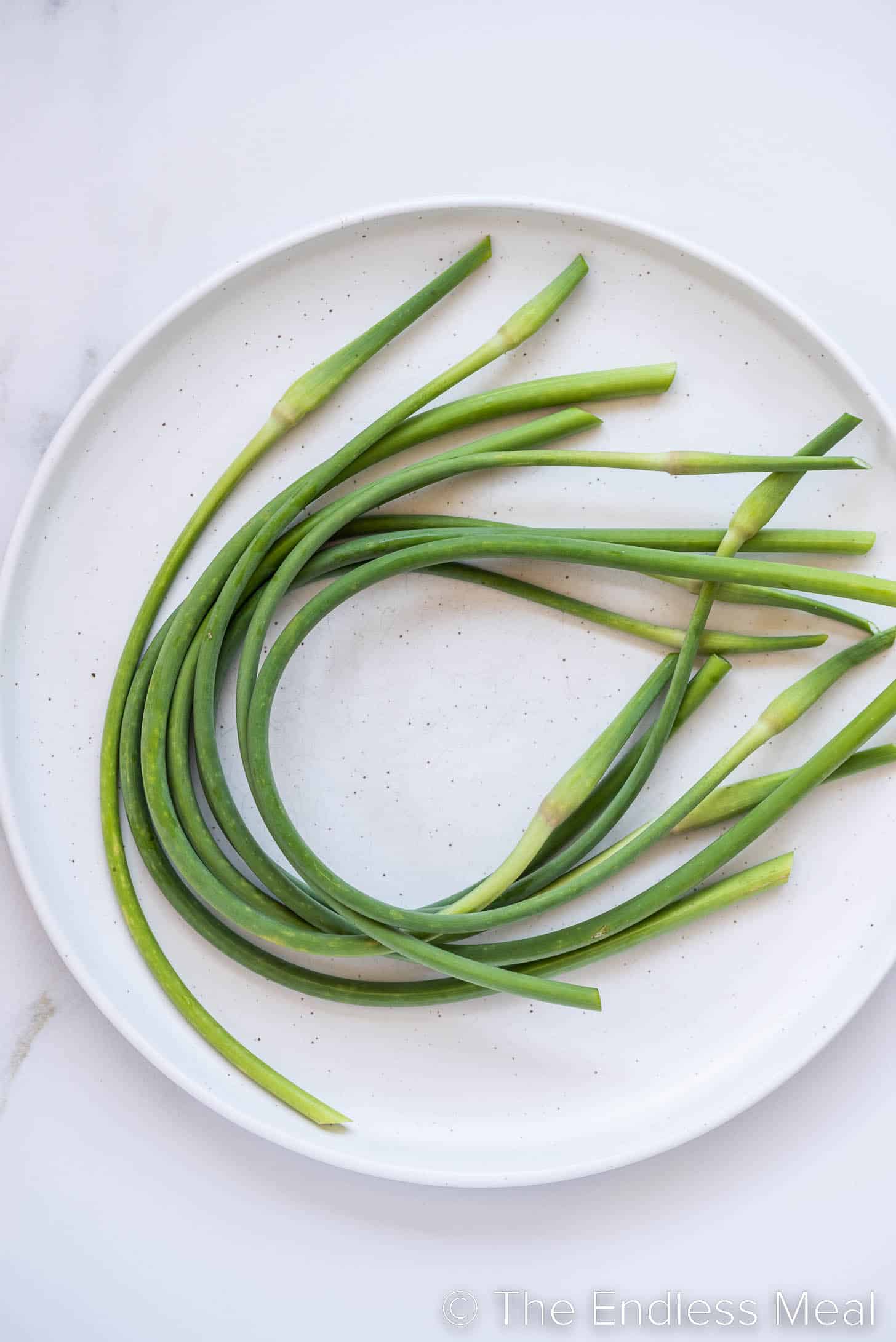Garlic Scapes curled up on a plate