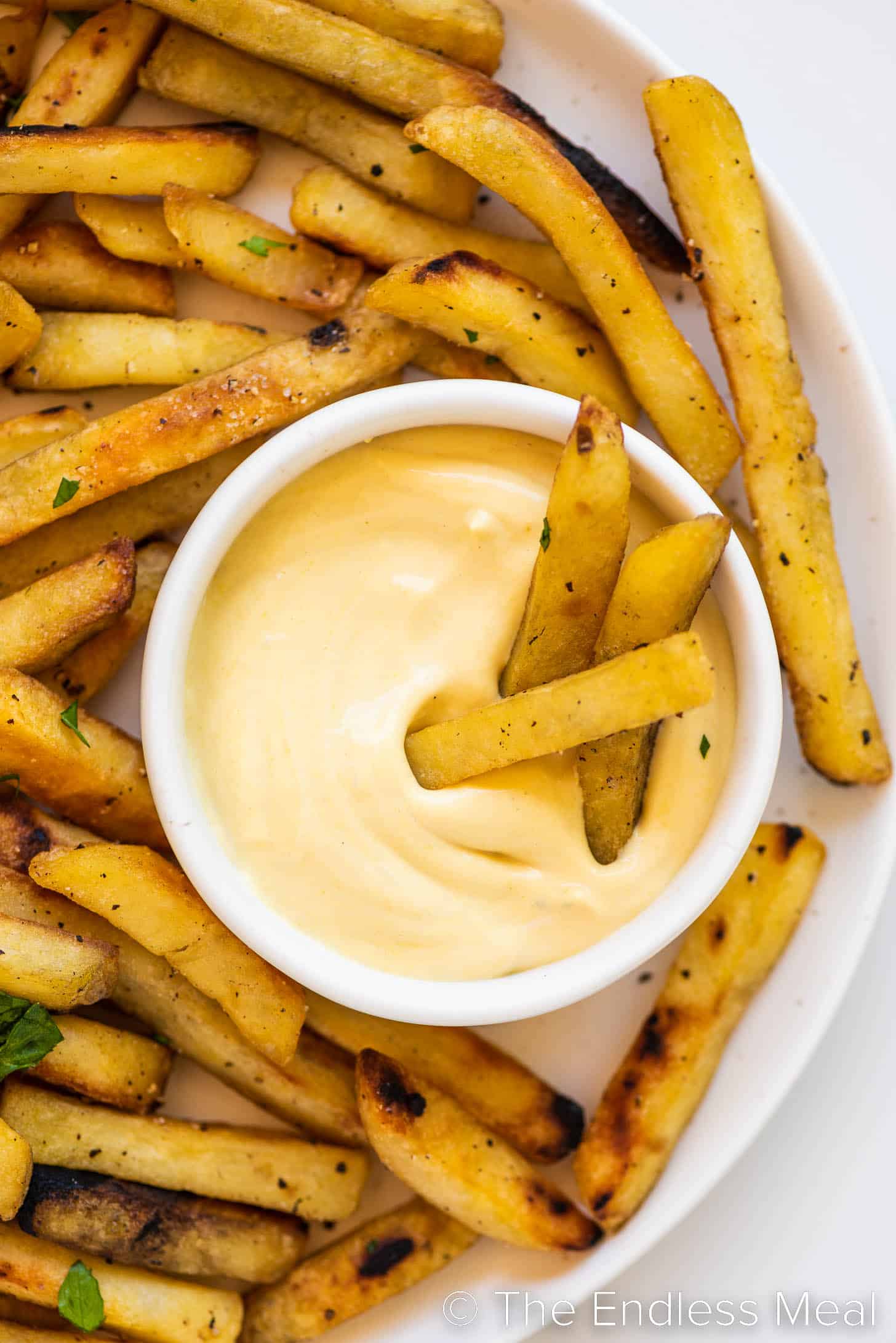 fries being dipped into Mayo Mustard Sauce