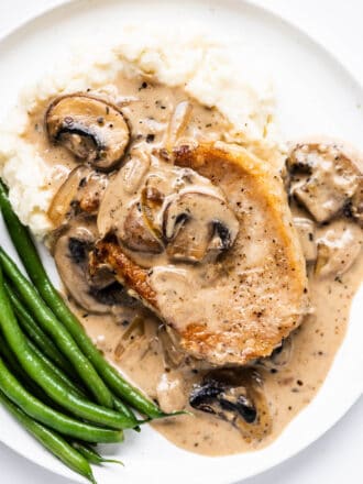 Smothered Pork Chops with Mushroom Onion Gravy on a plate
