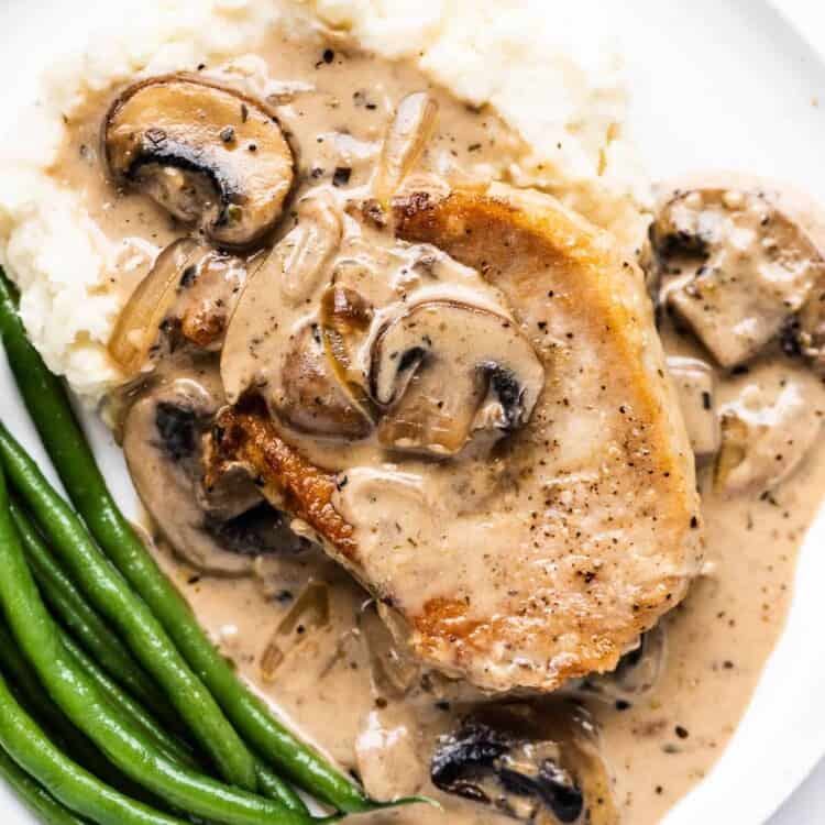 Smothered Pork Chops with Mushroom Onion Gravy on a plate