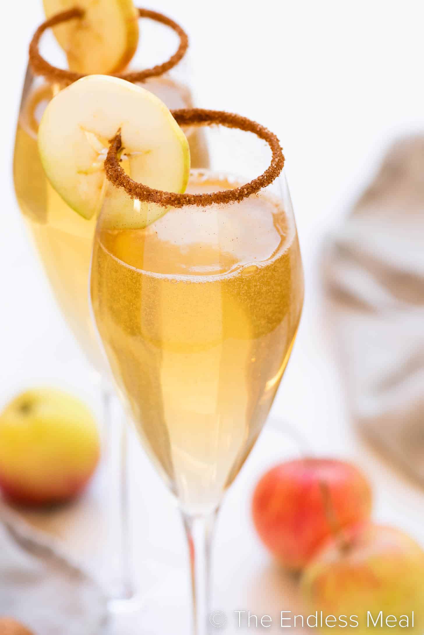 two Apple Cider Mimosas in champagne flutes