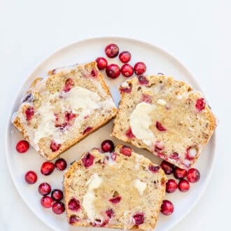 a plate with three slices of Cranberry Banana Bread