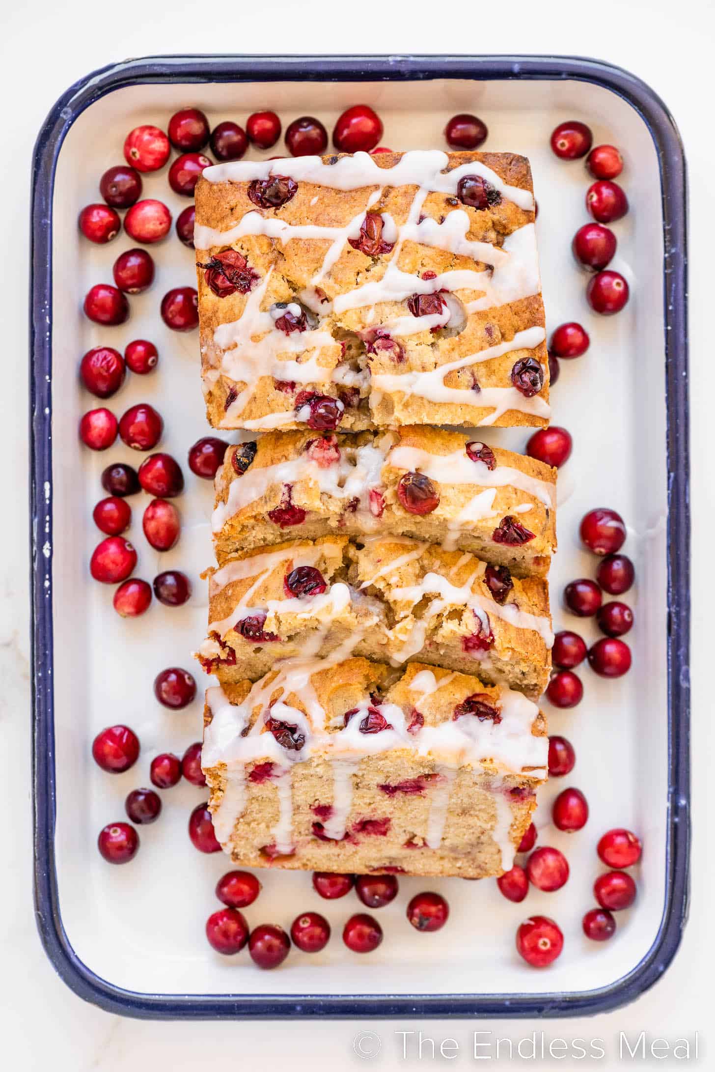 banana bread with cranberries on a serving platter
