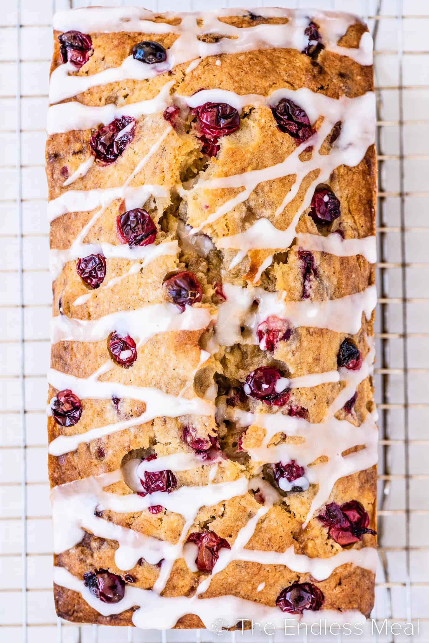 looking down on a loaf of glazed Cranberry Banana Bread