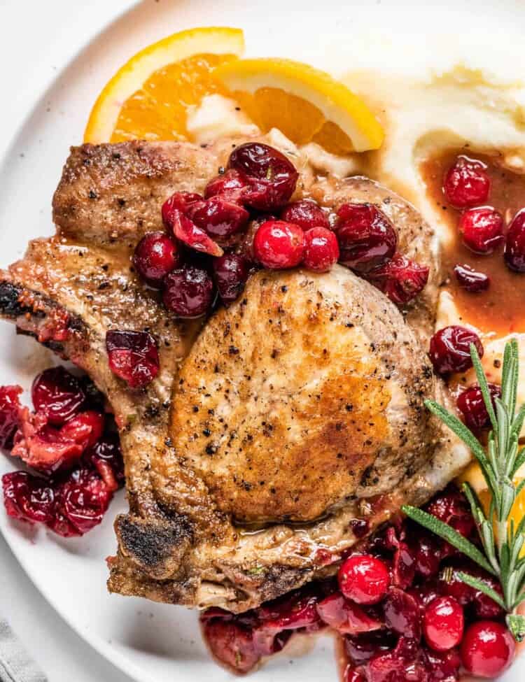 Cranberry Pork Chops on a plate with mashed potatoes