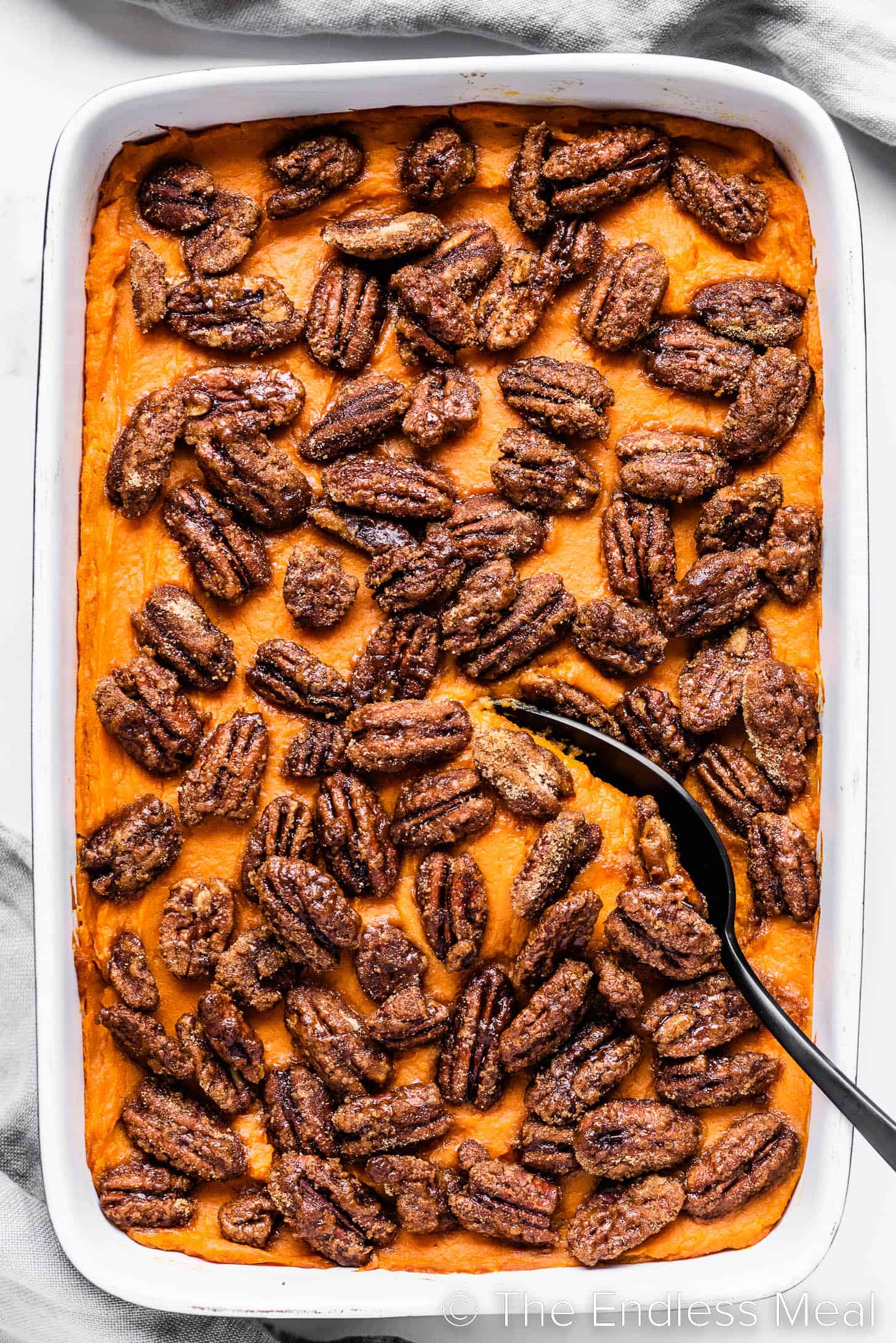 Easy Sweet Potato Casserole with a serving spoon