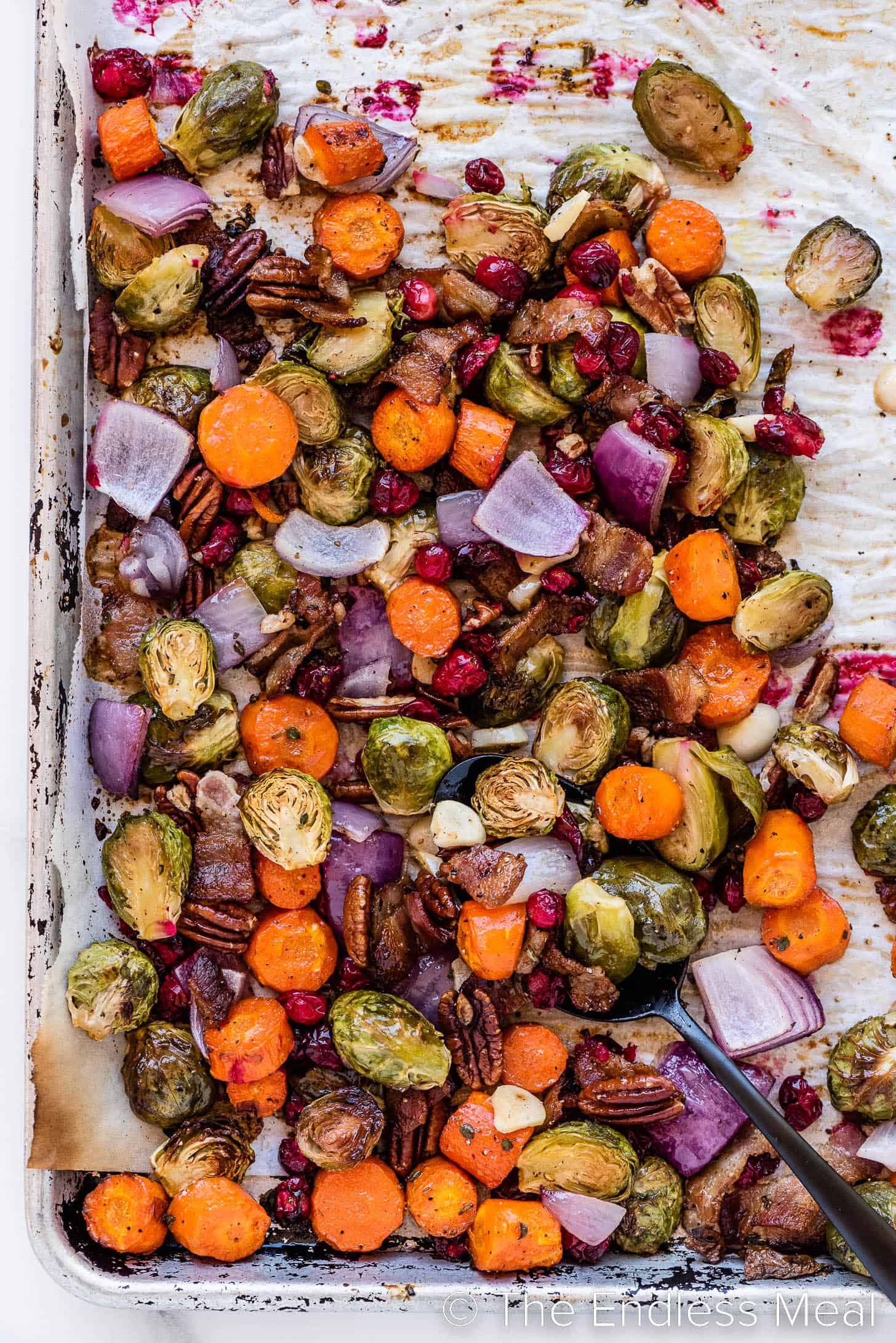 Christmas roasted vegetables on a baking sheet.