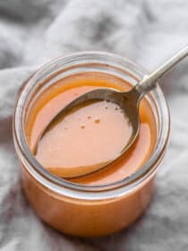 Bang Bang Sauce in a jar with a spoon