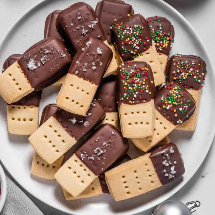 A plate of Chocolate Dipped Shortbread Cookies with sprinkles