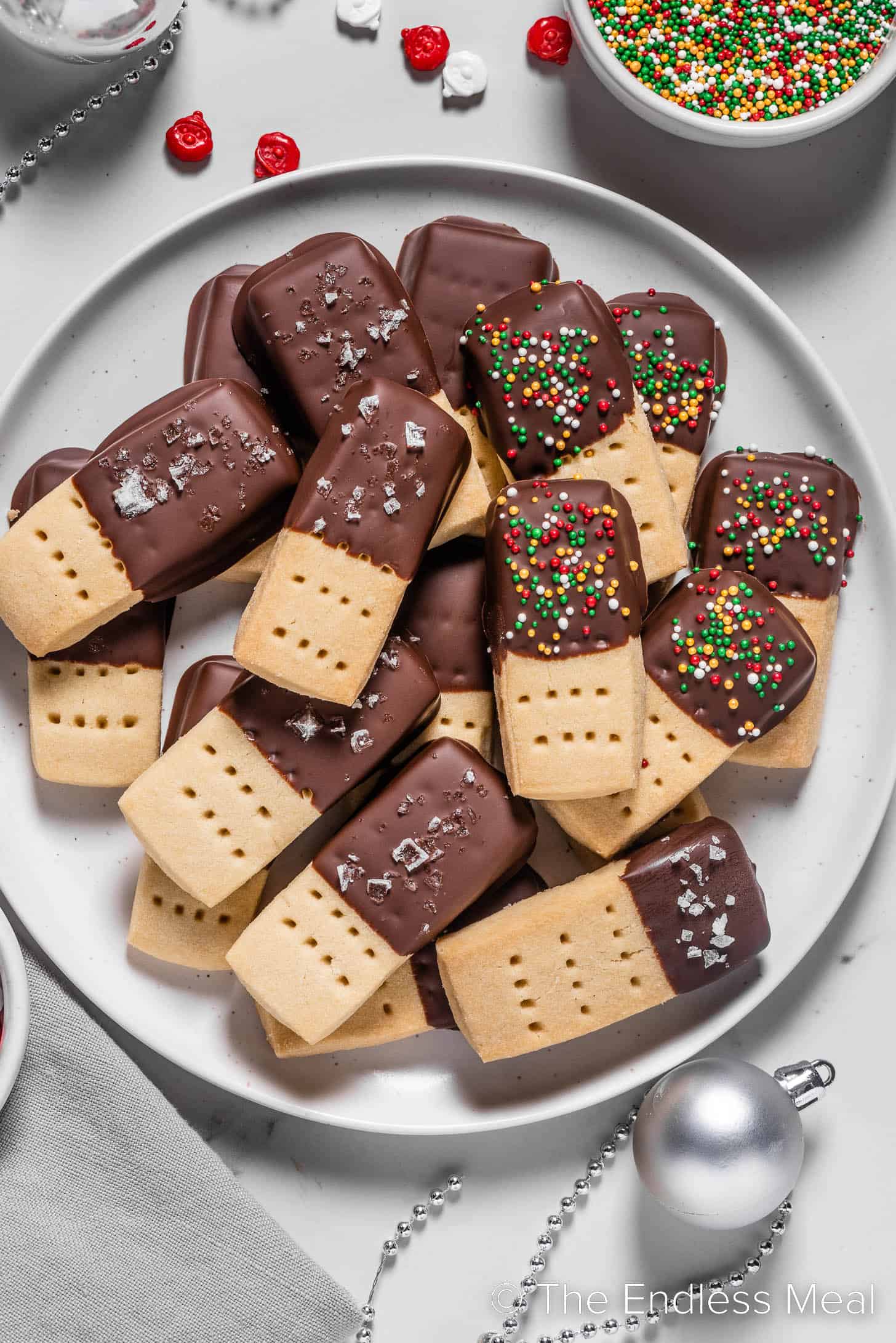 A plate of Chocolate Dipped Shortbread Cookies with sprinkles