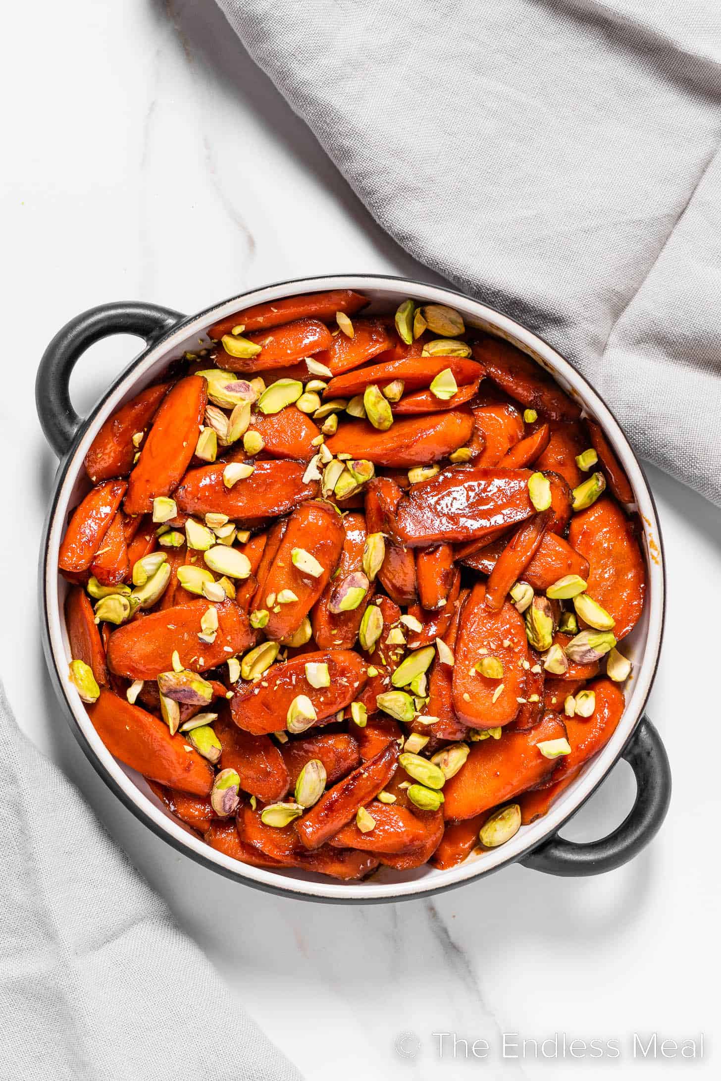 Bourbon Glazed Carrots topped with pistachios