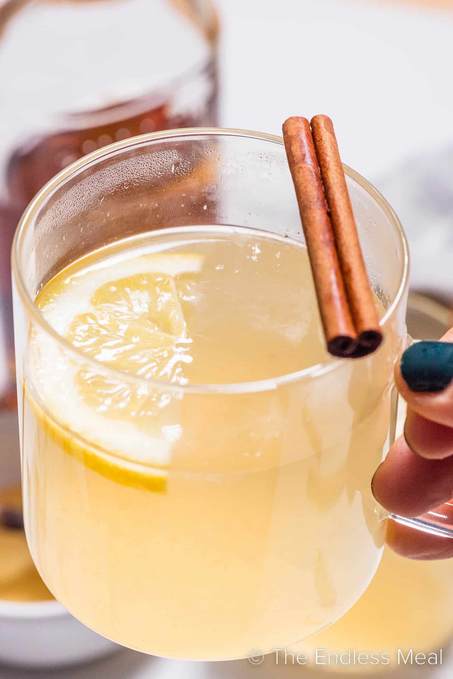 A hand holding a hot toddy.