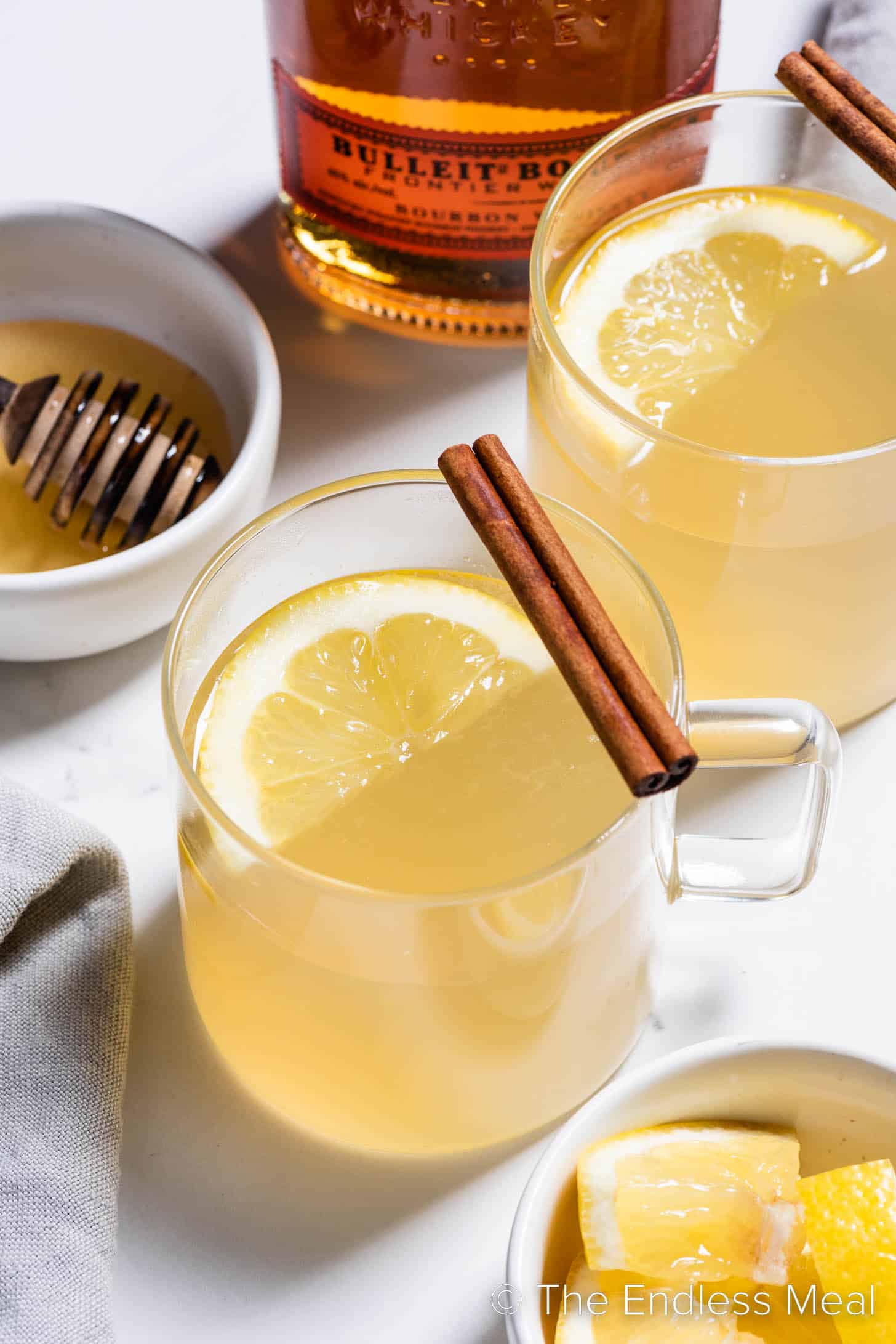 Hot toddy with whiskey in a glass mug