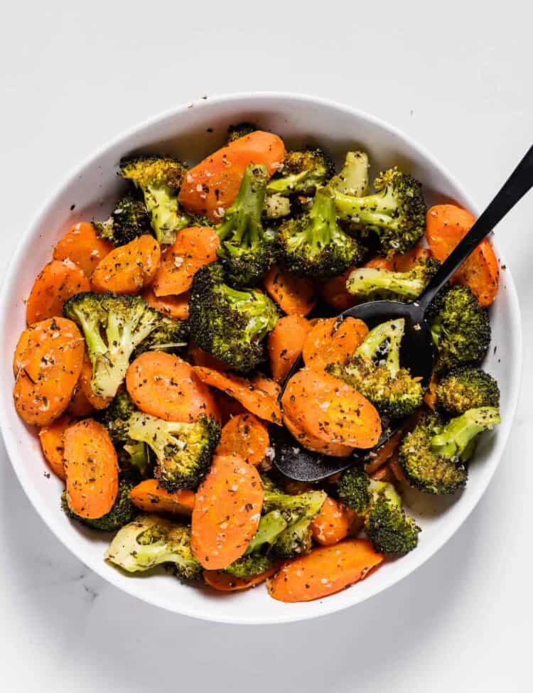 roasted carrots and broccoli in a serving dish