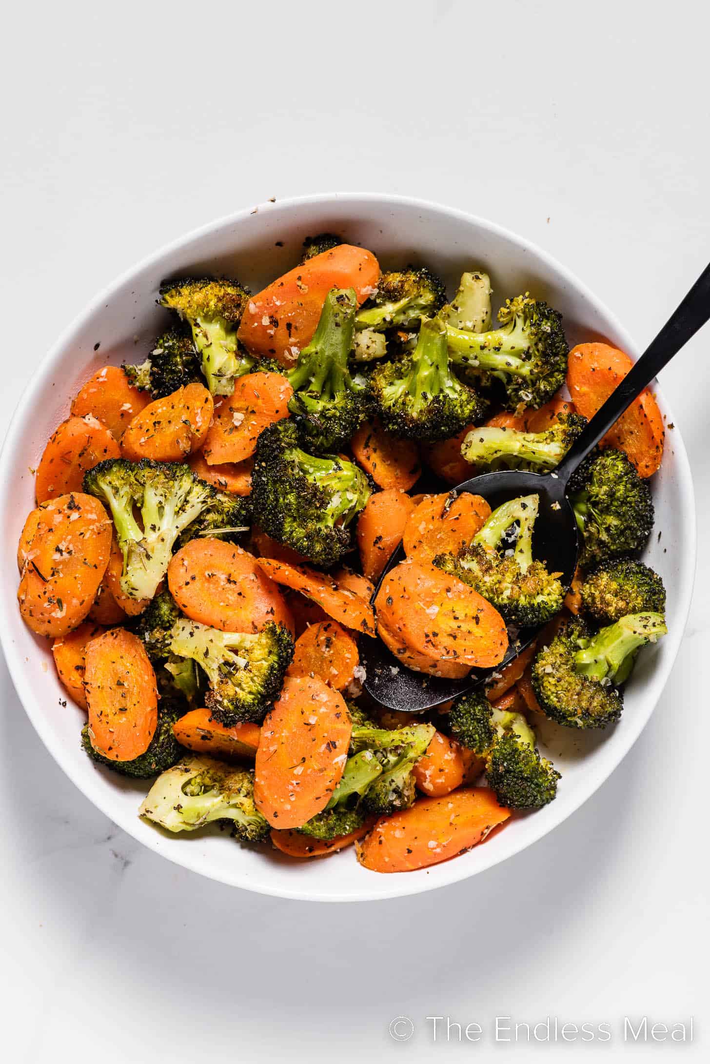 roasted carrots and broccoli in a serving dish