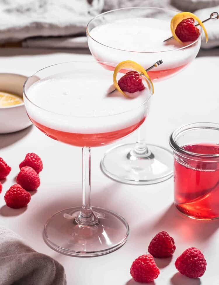 Two Clover Club Cocktail with raspberries