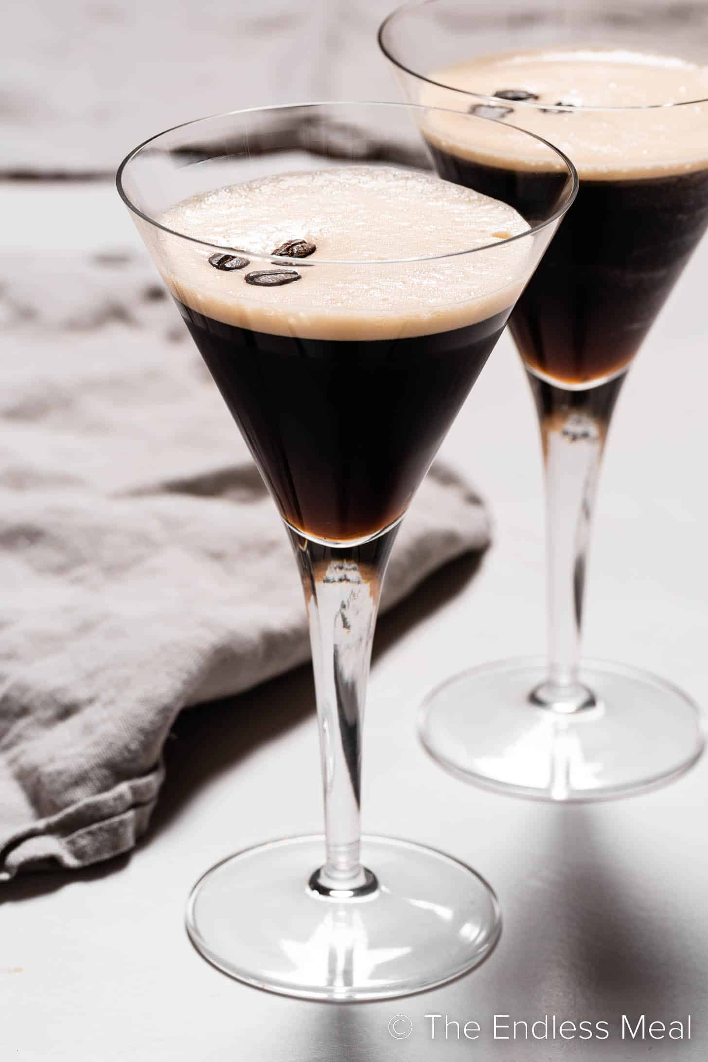 Two martini glasses with this espresso martini recipe