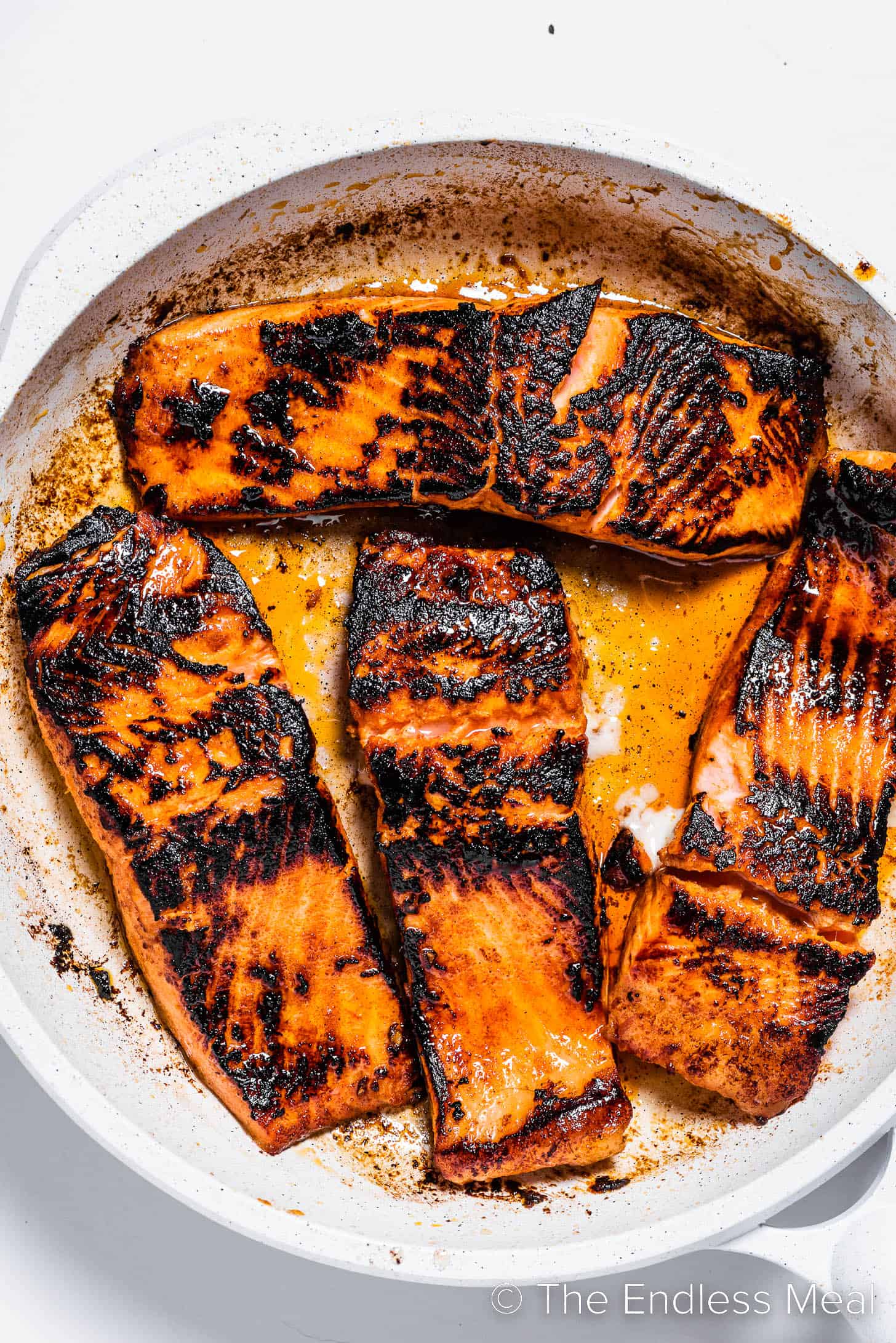 salmon cooking in a pan