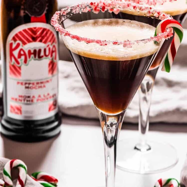 A Peppermint Espresso Martini with a Kahlua bottle in the background