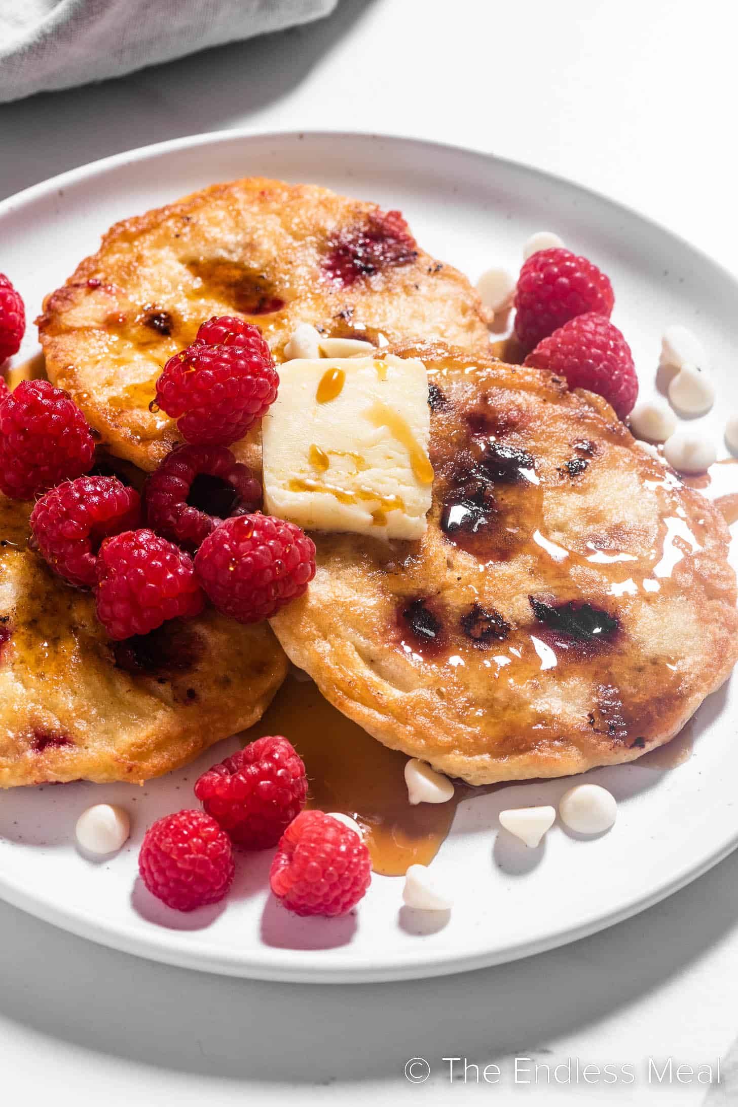 Three Raspberry Pancakes on a plate