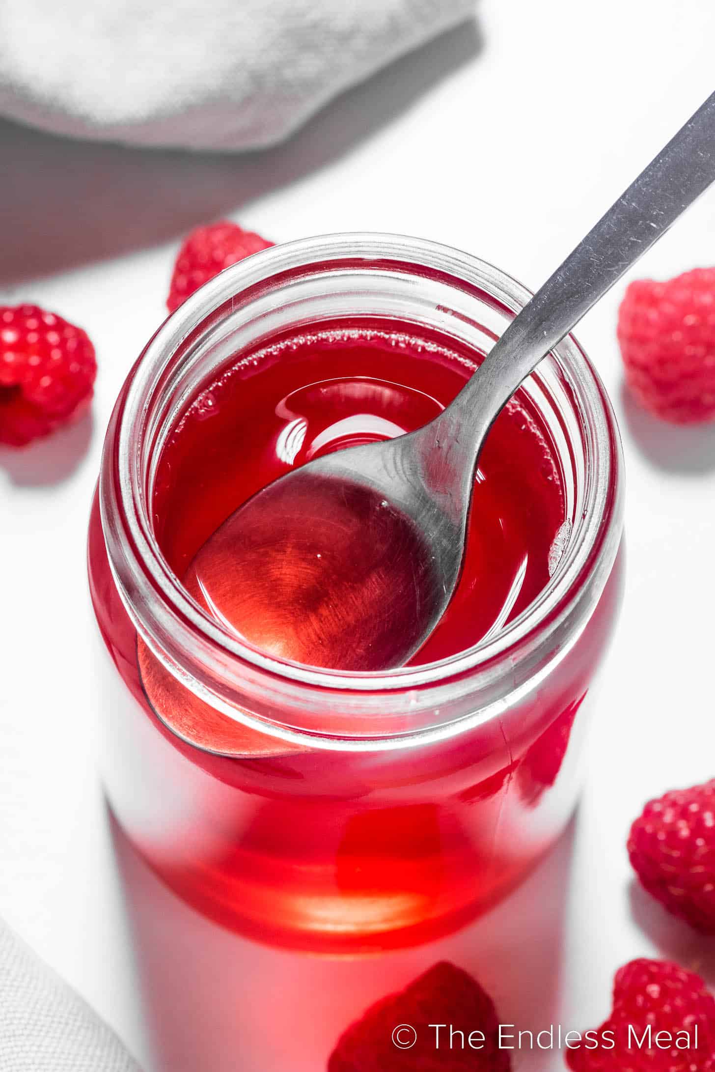 Raspberry syrup in a jar.