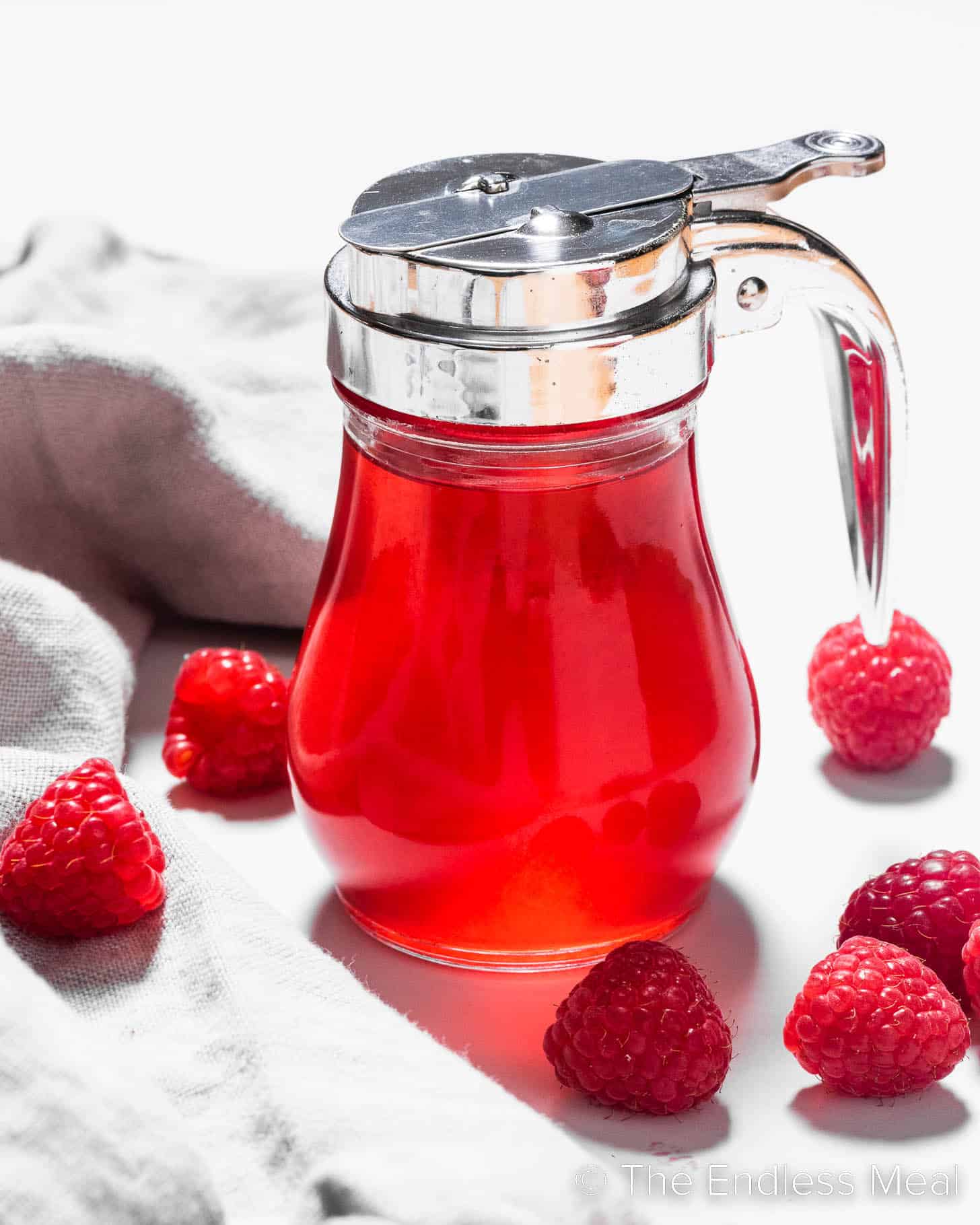 Raspberry Simple Syrup in s syrup jar