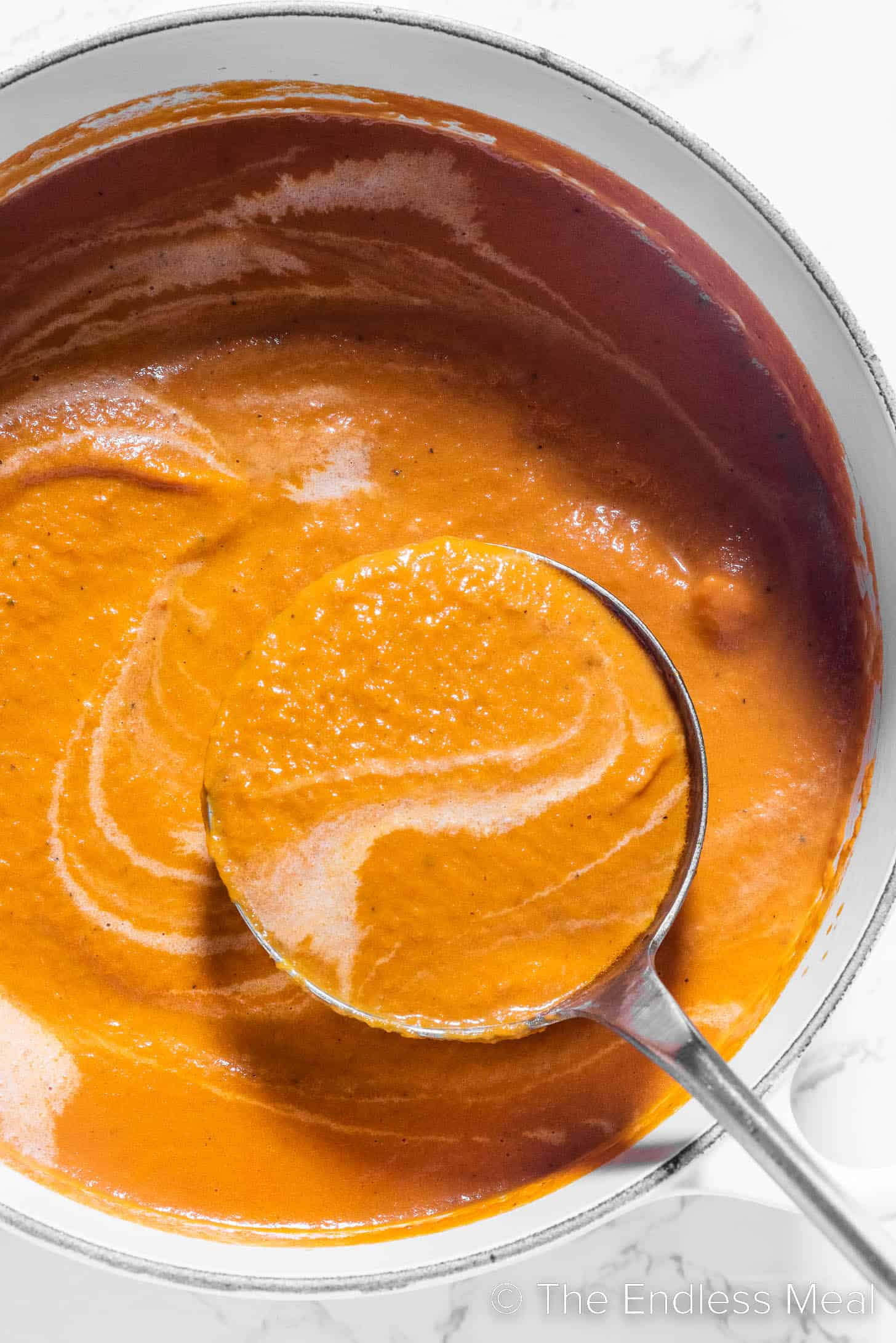 a pot of carrot tomato soup