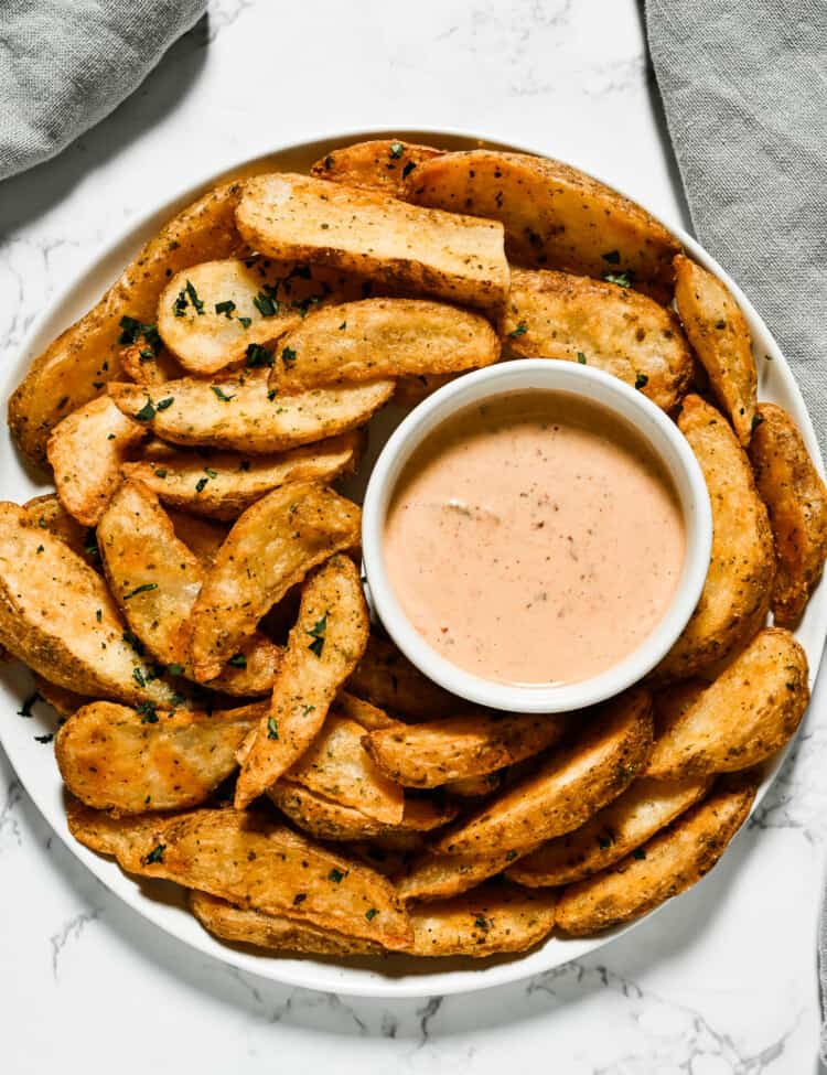Chipotle Mayo in a bowl next to french fries
