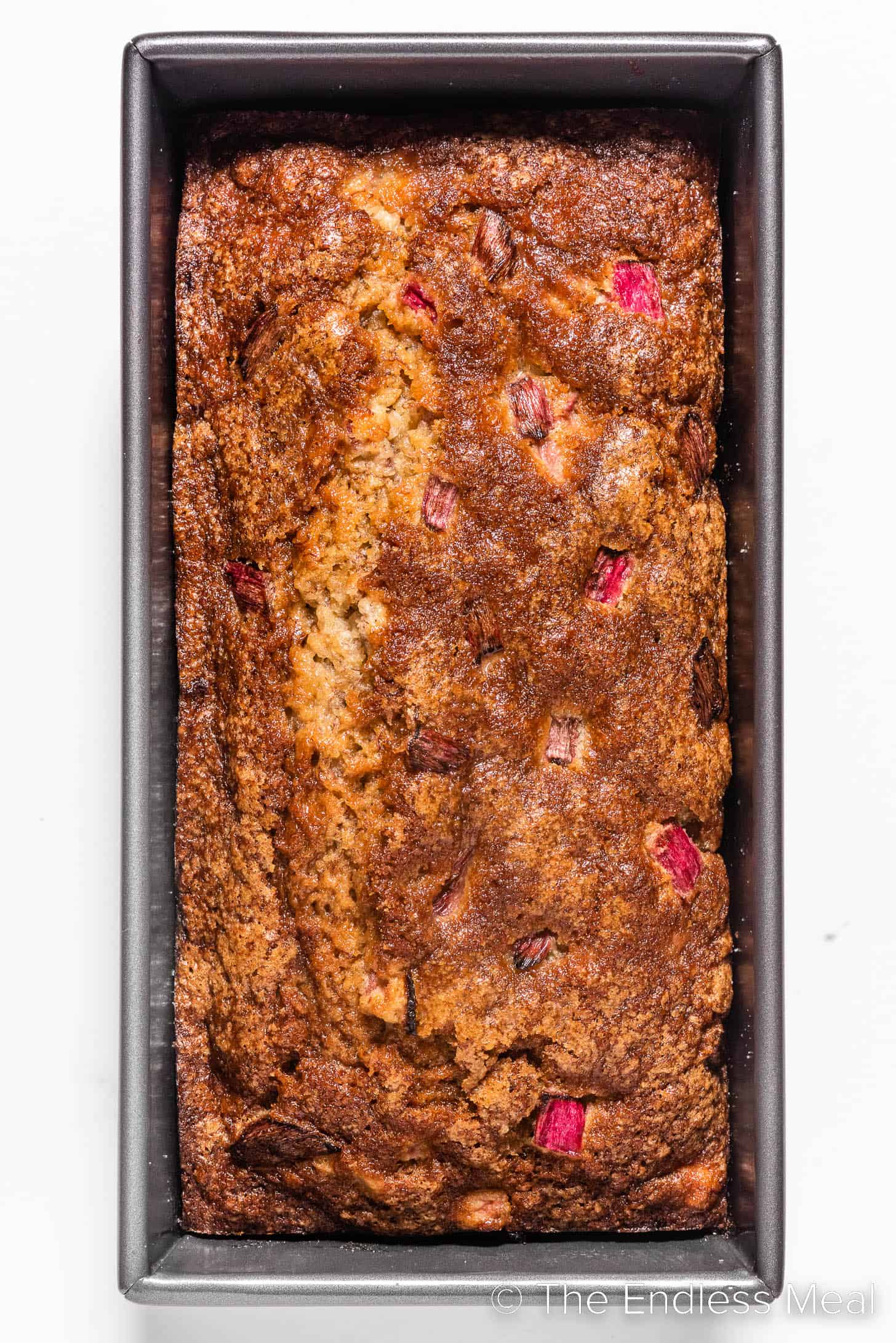 banana bread made with rhubarb in a loaf pan
