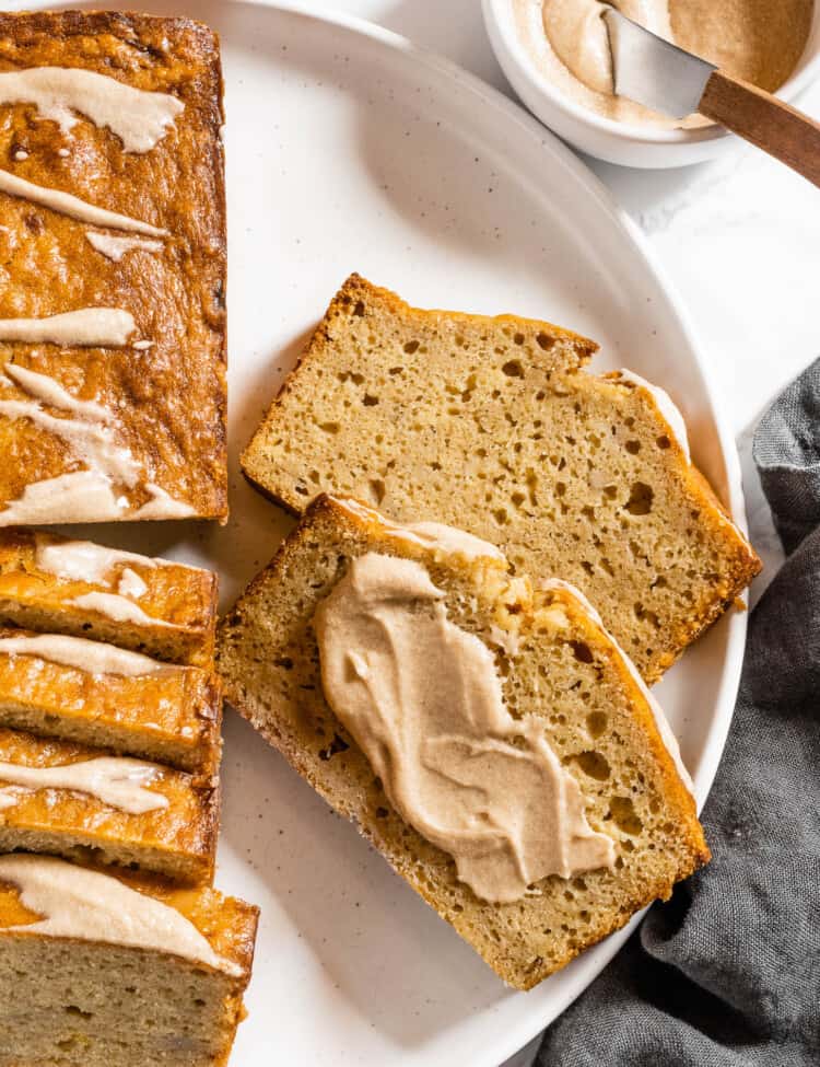 Two slices of Brown Butter Banana Bread topped with brown butter frosting