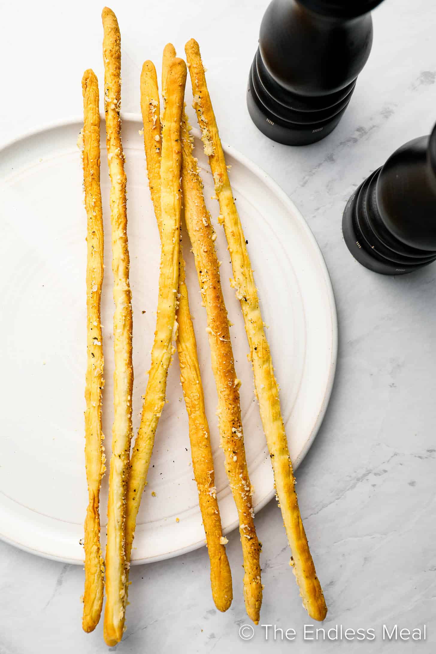 This Grissini Breadsticks recipe on a serving plate