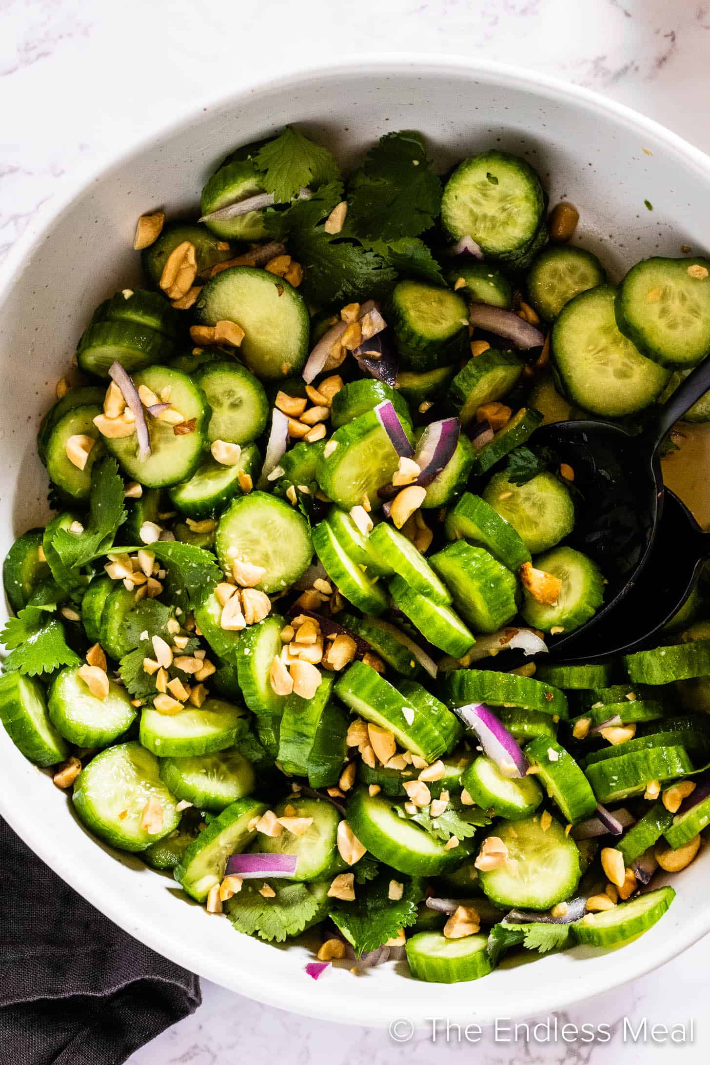 A close up of Thai Cucumber Salad in a serving bowl