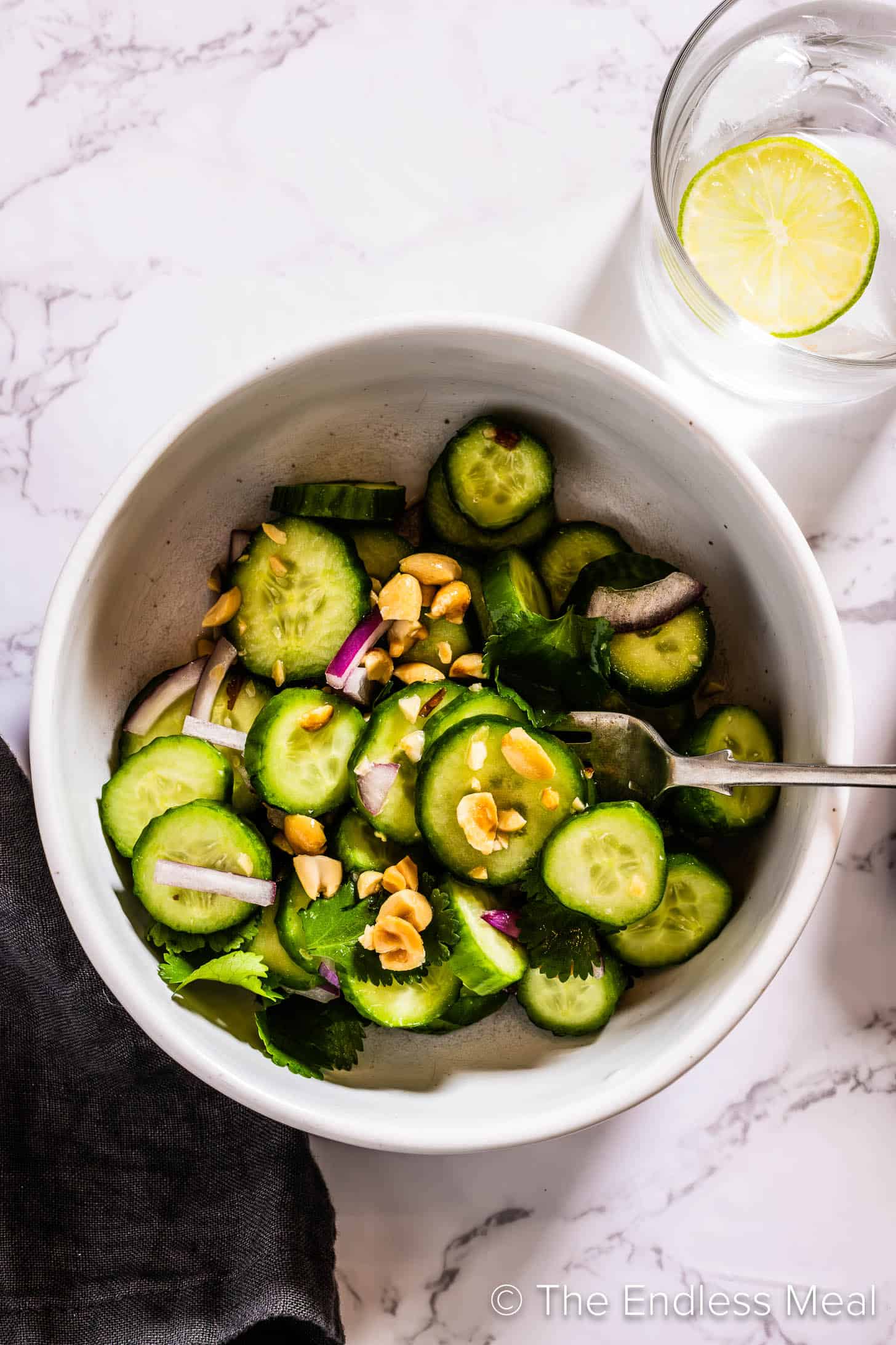 Thai Cucumber Salad in a bowl with a fork