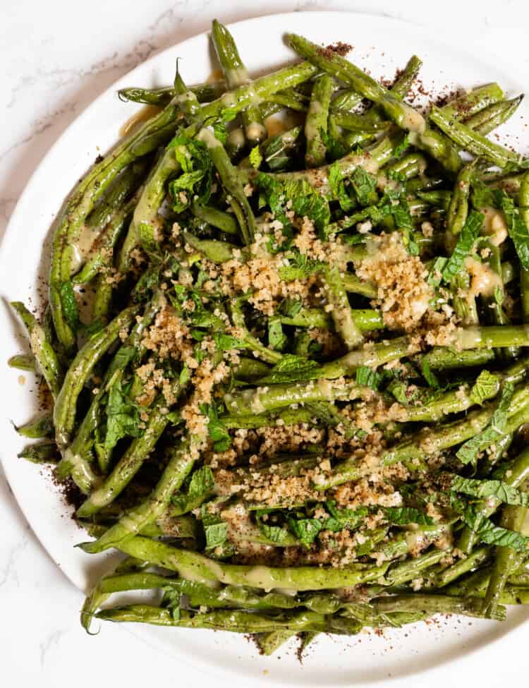 a close up of Green Beans with Tahini on a plate