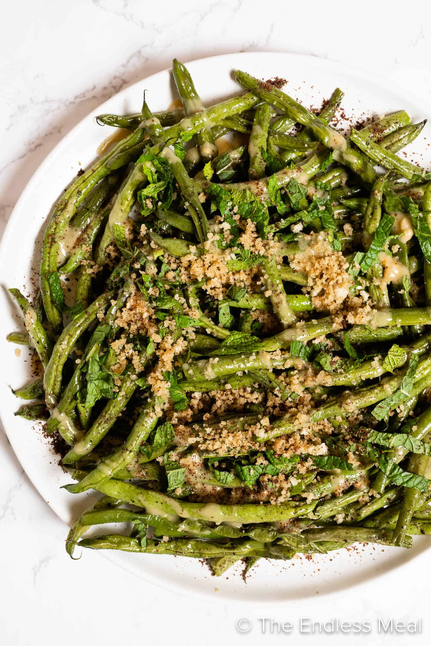 a close up of Tahini Green Beans on a plate