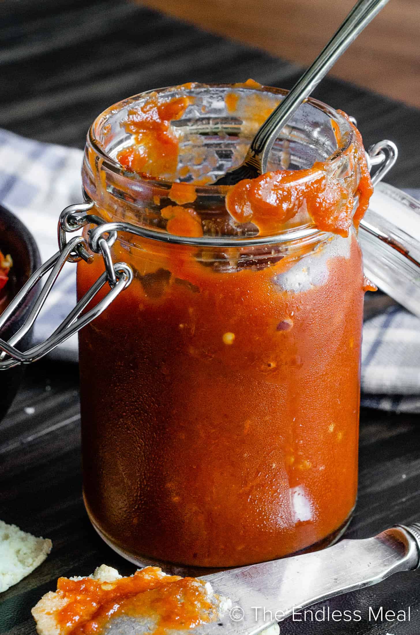 a glass jar filled with Spicy Tomato Jam