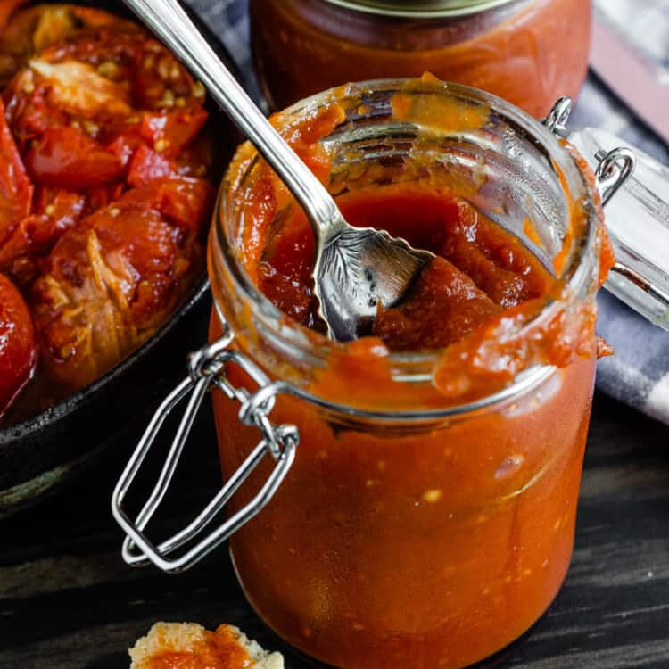 Spicy Tomato Jam in a glass jar.