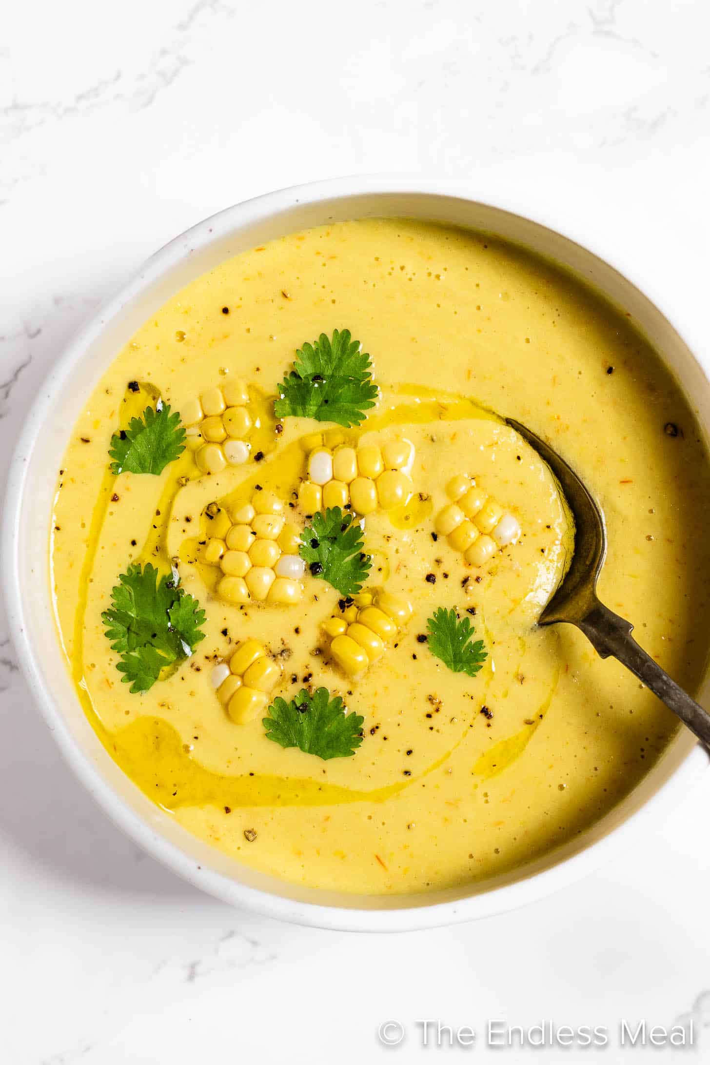 Corn Gazpacho in a bowl with a spoon