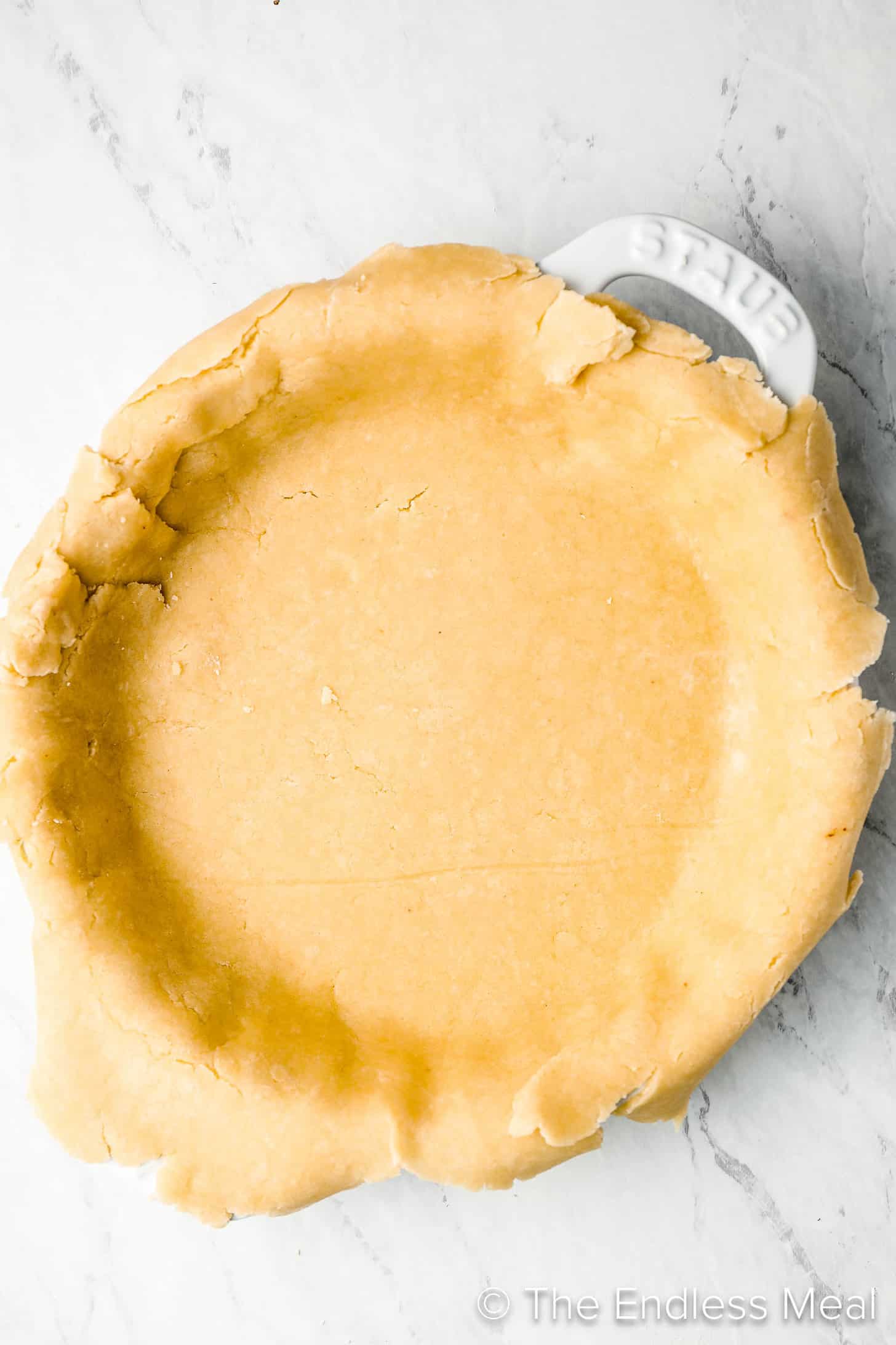 Butter and Shortening Pie Crust rolled out and in a pie pan