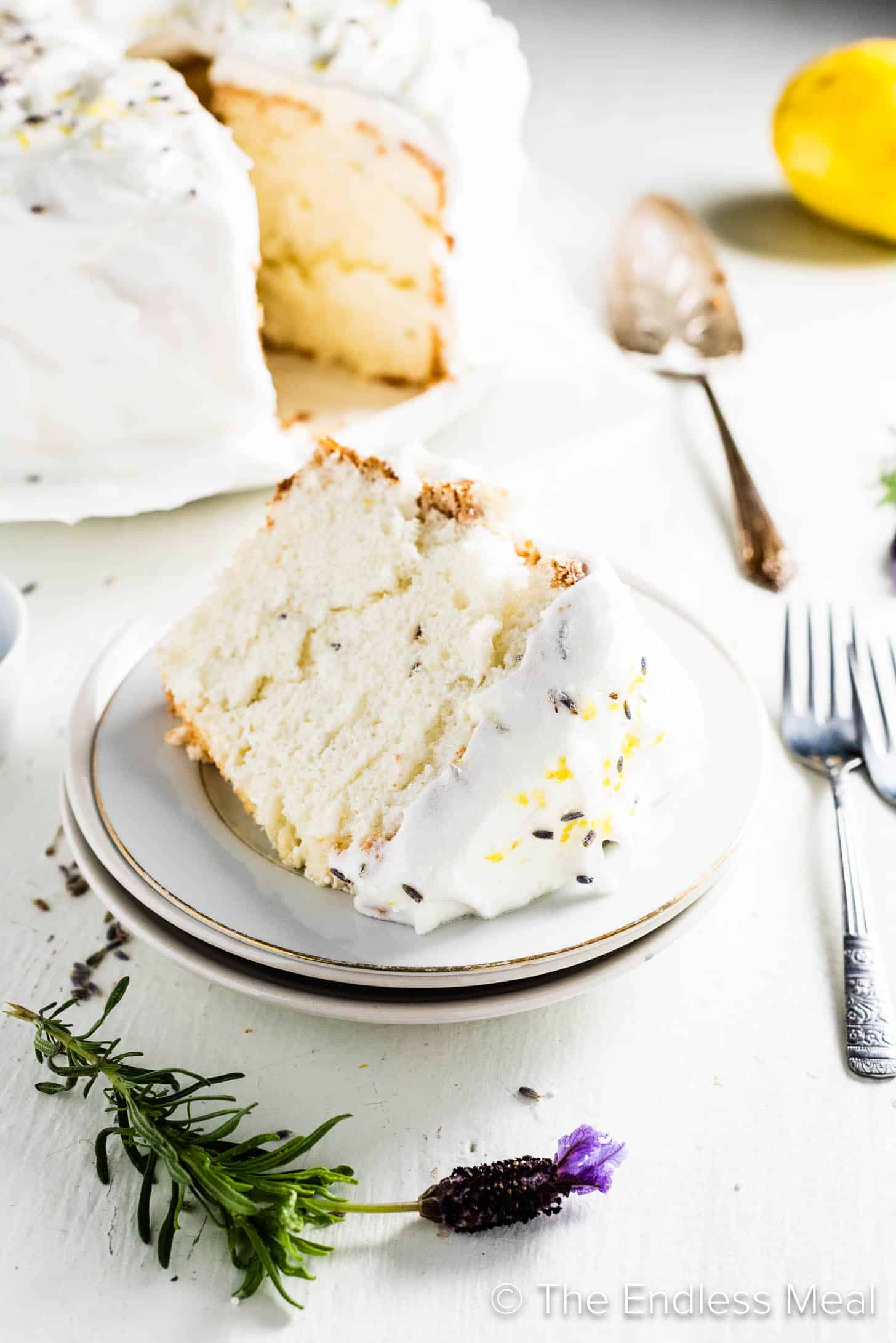 A slice of Lavender Lemon Angel Food Cake on a dessert plate