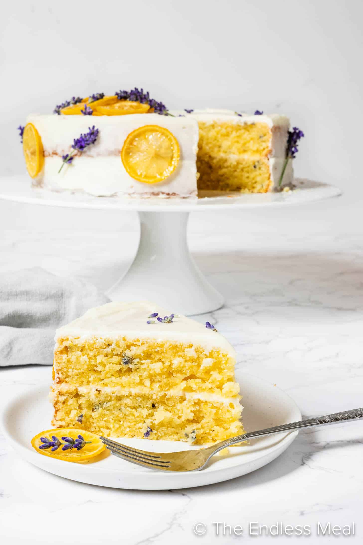 A slice of Lemon Lavender Cake on a dessert plate