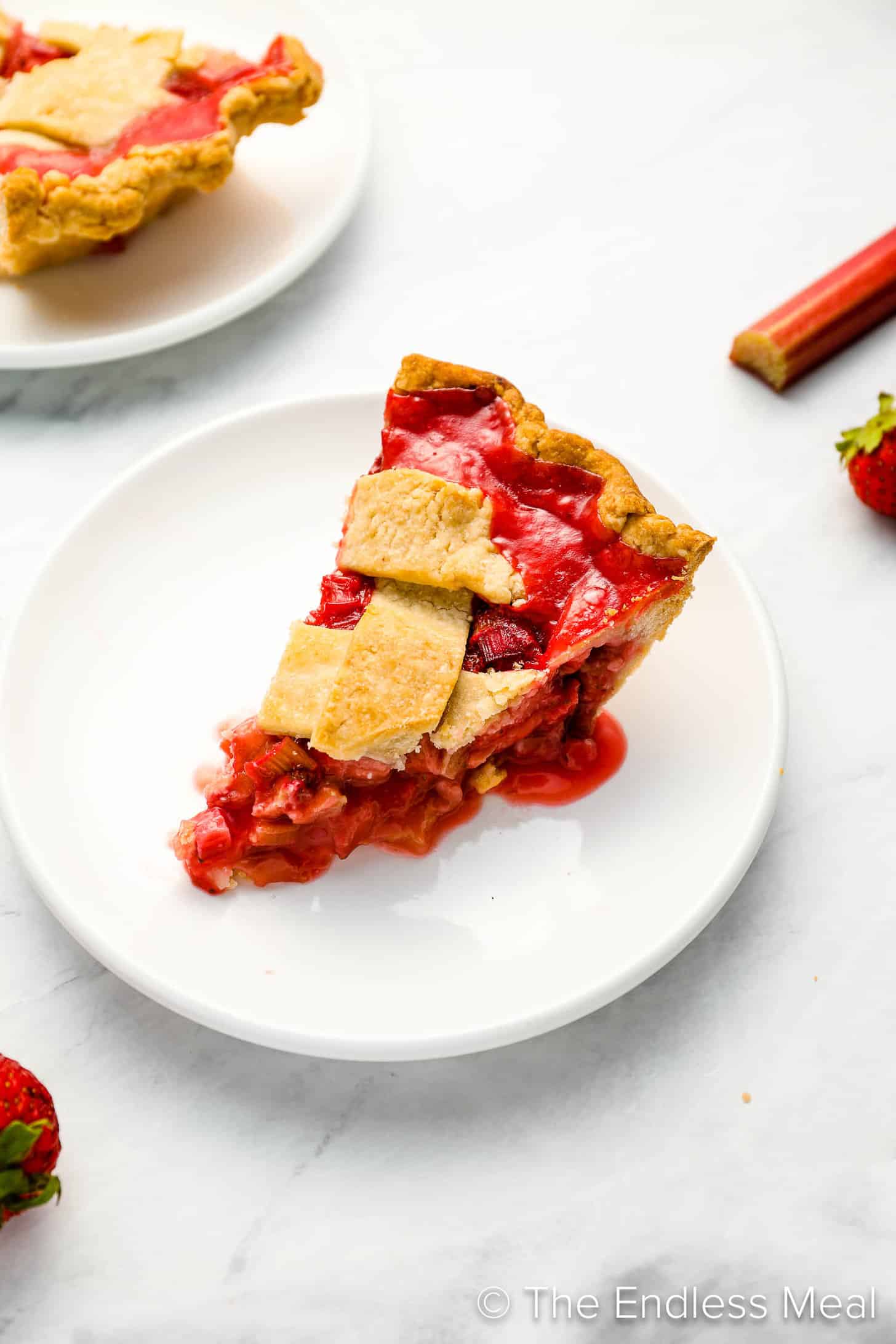 A slice of Strawberry Rhubarb Pie on a dessert plate